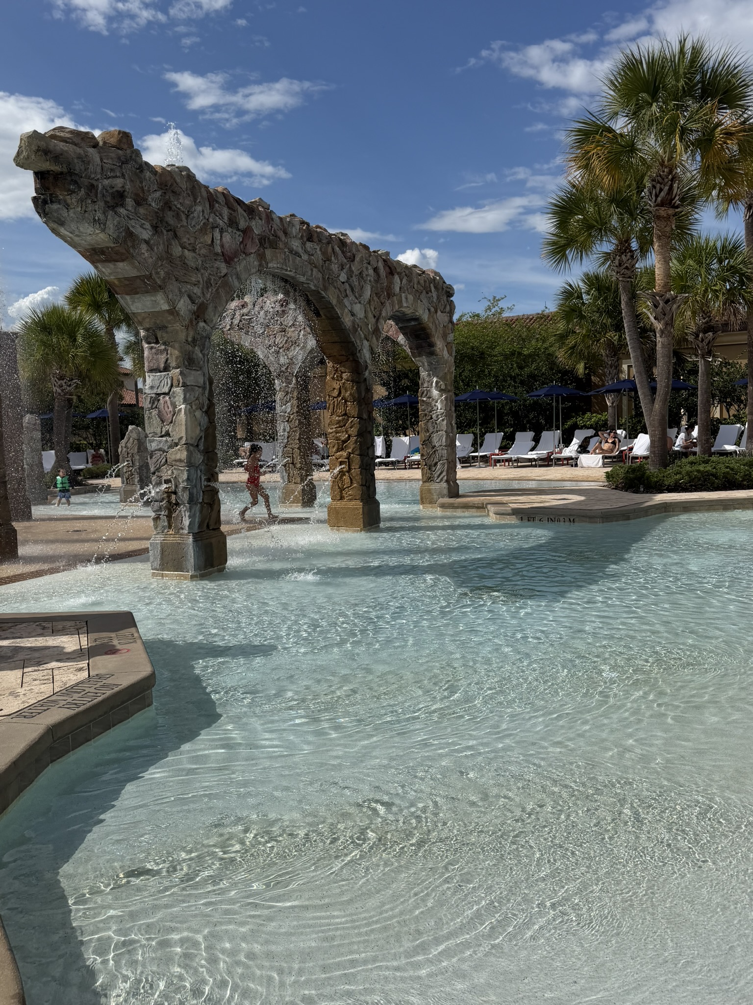 Explorer Island splash zone with stone arches and fountains